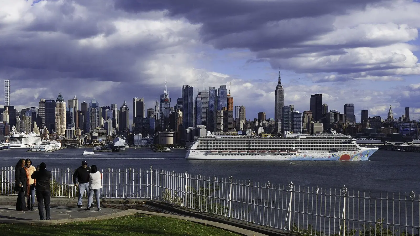 The Manhattan skyline with the Empire State Building and a cruise ship on the Hudson River, seen from Weehawken, New Jersey