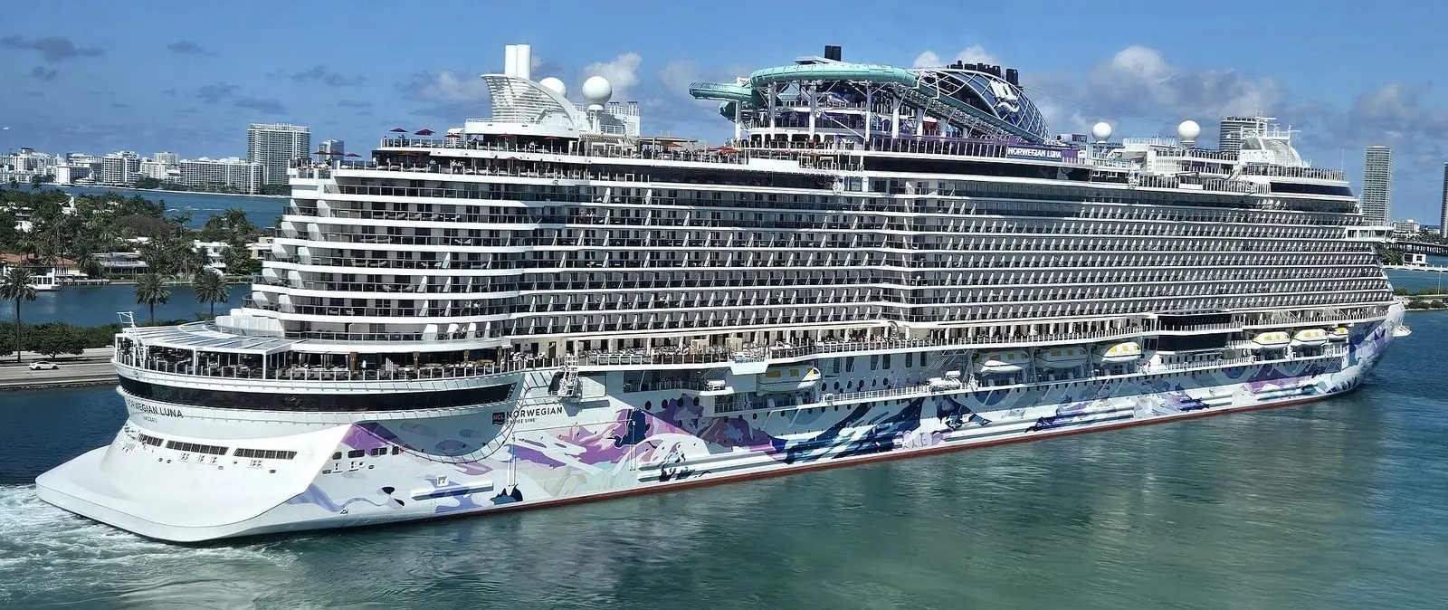 Norwegian Luna leaving PortMiami in April 2026, with its hull art and the ship name on the stern